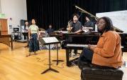 ODU students listen during the Lisanne Lyons clinic. Pictured, left to right, are Makenzie Joyner-Cassanova at the piano, Jack Moreno on bass, Kristian Quilon on saxophone, Michael Berry on drums, Kristiana Jones on vocals, and Mike Dean on guitar.